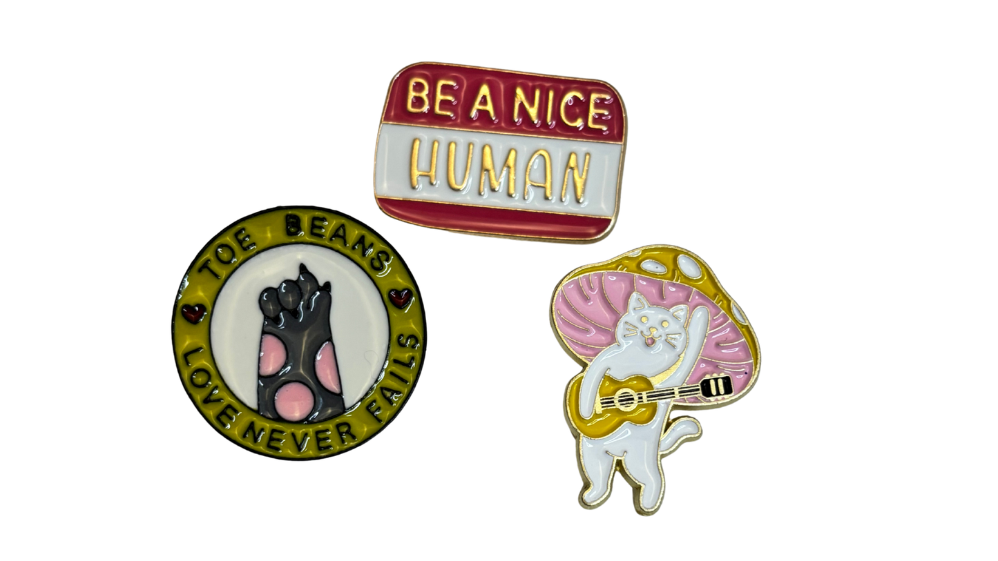 Set of 3 Cute Enamel Lapel Pins – Cat, “Be a Nice Human,” and Toe Beans Designs