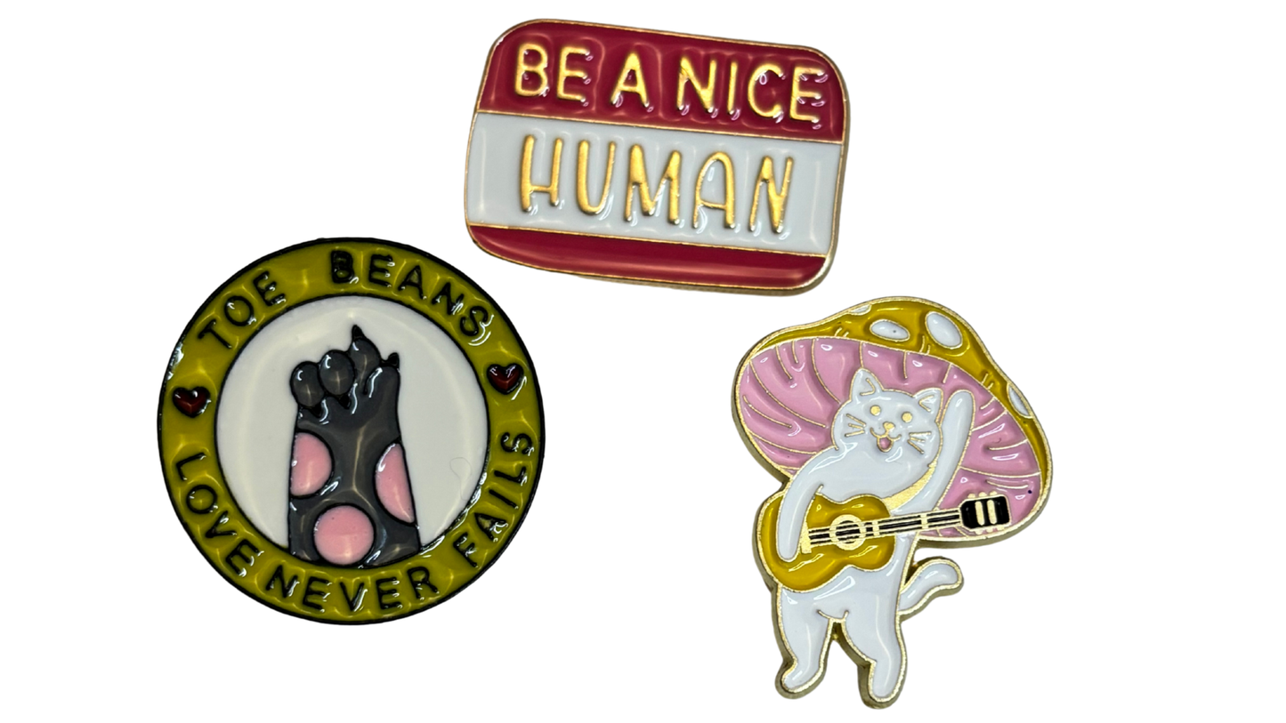 Set of 3 Cute Enamel Lapel Pins – Cat, “Be a Nice Human,” and Toe Beans Designs