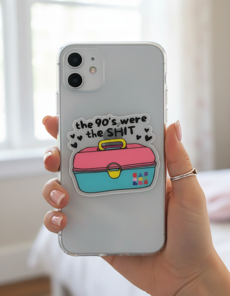 Phone case with colorful design and text held by a hand